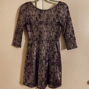 Black and gold scoop back dress